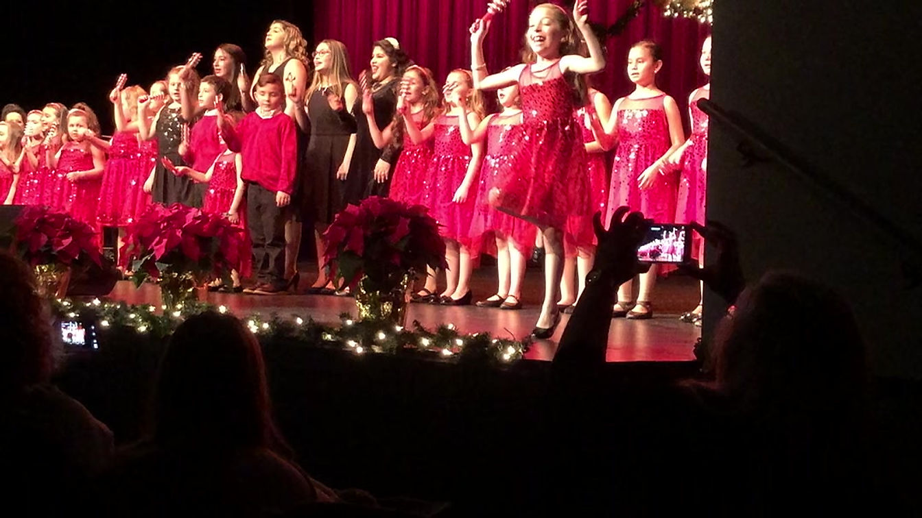 The Little Language Studio singing "Jingle Bells" on-stage at Symphony Space, NYC